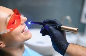 a person undergoing a dental filling procedure, wondering how soon they can eat after.